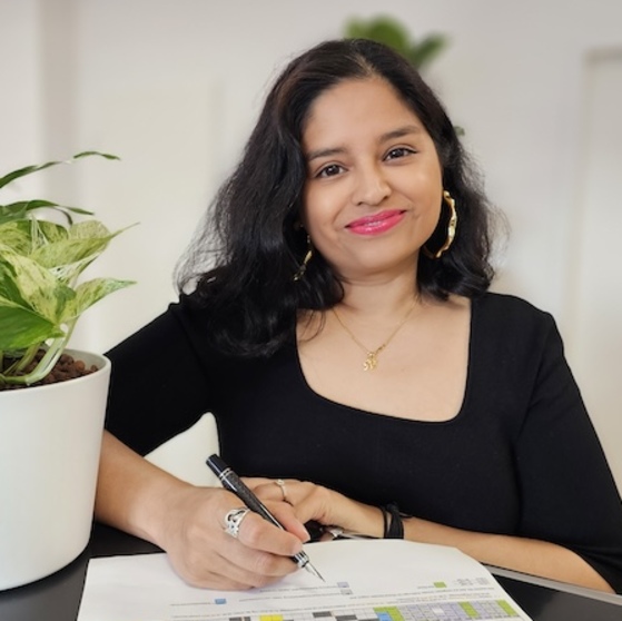 anagha deshpande with a pen
